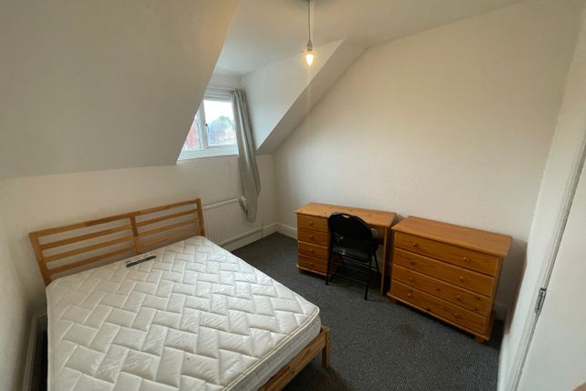 A Spacious And Bright Double Bedroom With A Desk A...