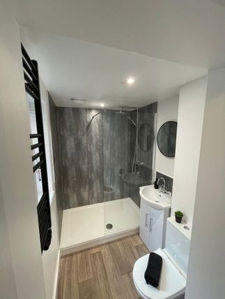 Modern Bathroom Featuring A Spacious Walk-In Showe...