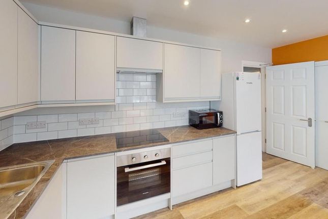A Modern And Tidy Kitchen Featuring Ample Storage ...