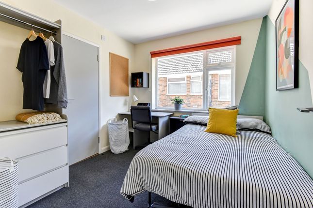 Bright And Tidy Single Bedroom Featuring A Comfort...