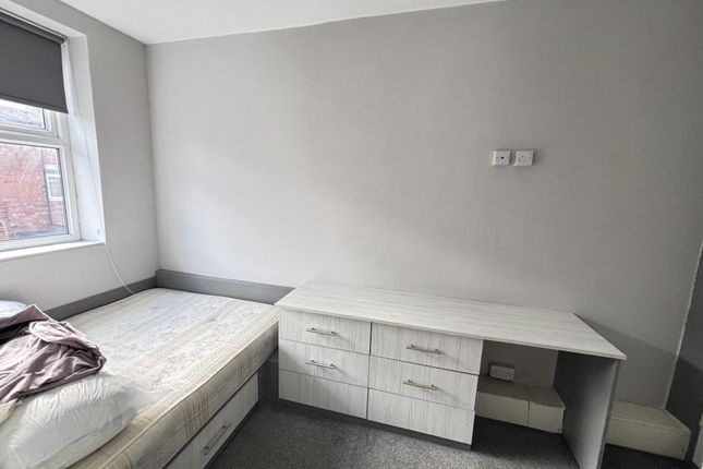 A Bright, Well-Maintained Bedroom Featuring A Spac...