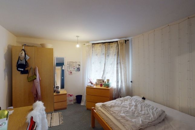 A Cozy Double Bedroom Featuring Ample Storage And ...