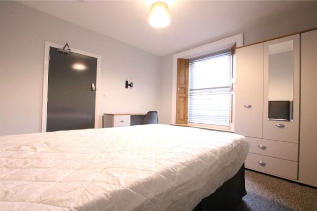 A Bright And Tidy Double Bedroom With A Comfortabl...