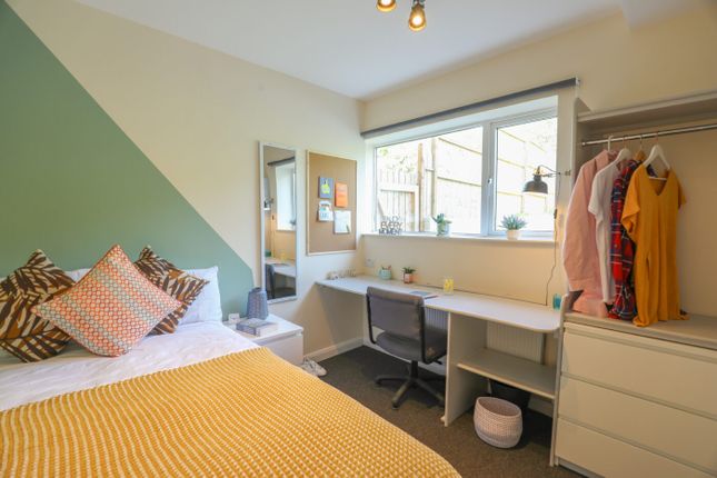 Bright And Welcoming Bedroom With A Stylish Accent...