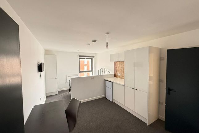 Modern Kitchen Area Featuring Sleek Cabinetry And ...