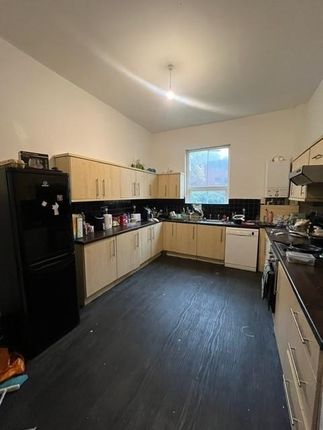 A Spacious, Well-Lit Kitchen With Ample Cabinetry ...