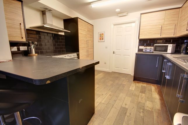 A Spacious And Modern Kitchenette With Ample Stora...
