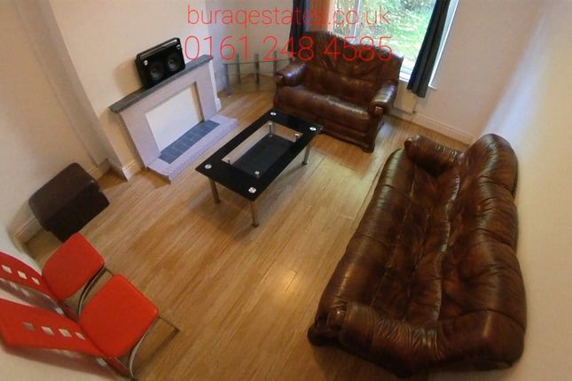 A Spacious And Welcoming Living Room Featuring Com...