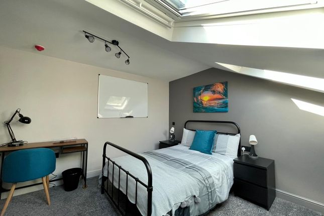 A Bright And Inviting Double Bedroom Featuring A c...