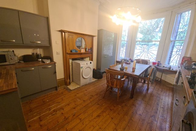 Spacious Kitchen With Charming Wooden Flooring And...