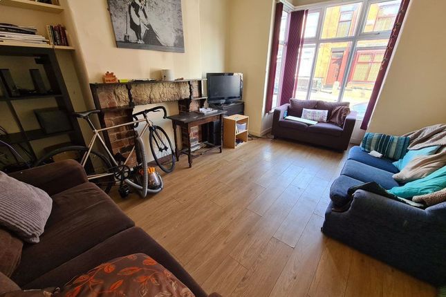 Bright And Welcoming Living Room Featuring Large W...