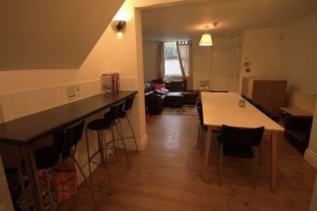 A Spacious And Well-Lit Living Room Featuring Mode...