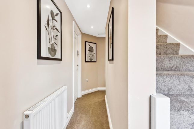A Stylish Hallway Adorned With Modern Artwork, Fea...