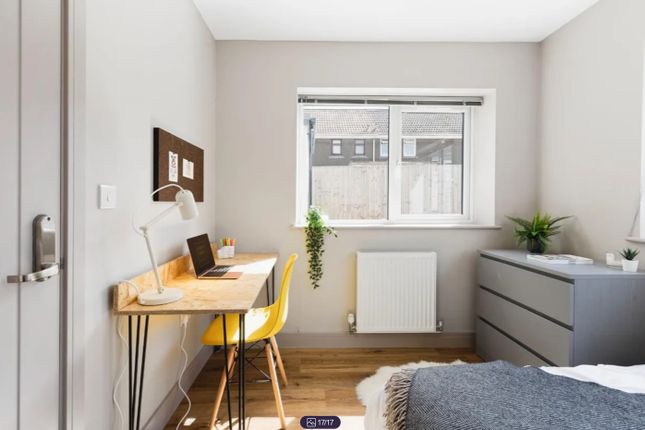 A Bright And Clean Double Bedroom Featuring A Work...