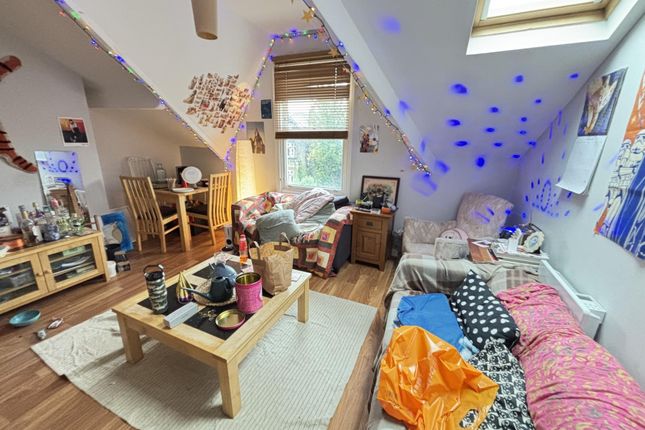 A Spacious And Well-Lit Living Room Featuring Mode...