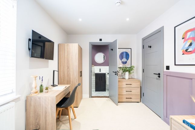 Bright And Inviting Bedroom Featuring A Modern Des...