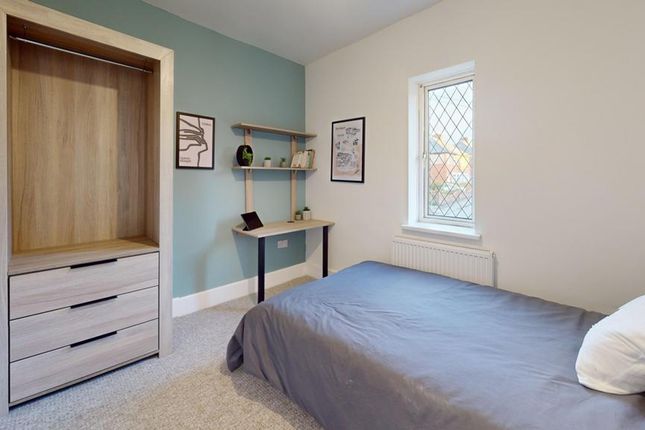 A Bright And Tidy Double Bedroom Featuring A Fitte...