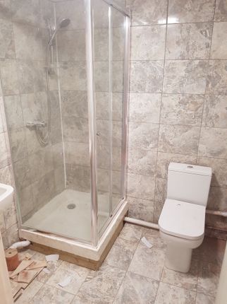 A Functional Bathroom Featuring A Modern Shower An...