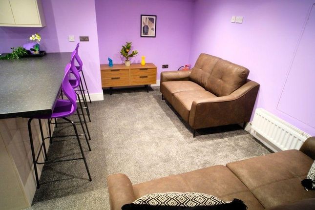 A Cozy And Well-Maintained Living Room Featuring c...