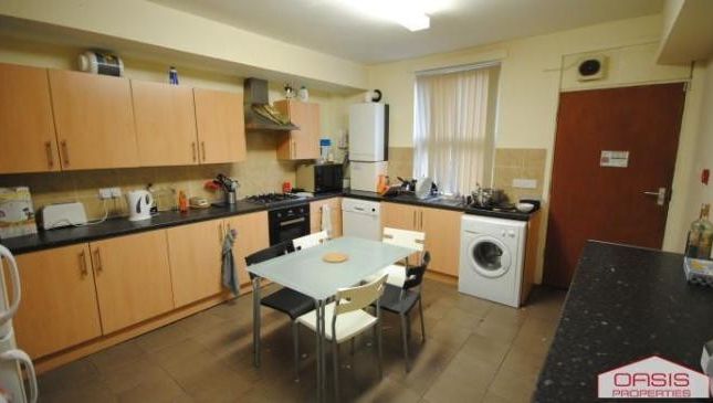 A Bright And Functional Kitchen With Ample Cabinet...