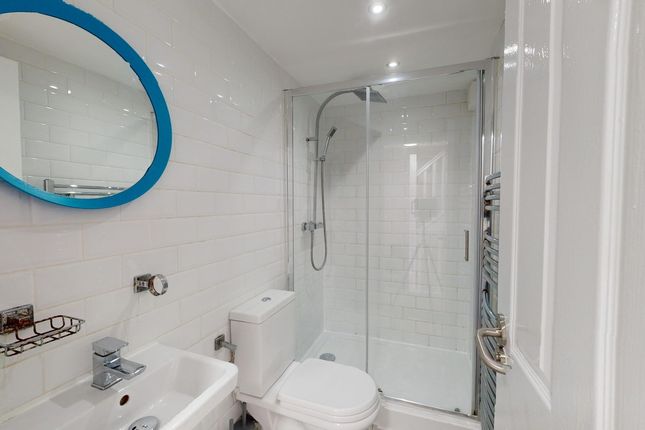 A Modern And Clean Bathroom With A Stylish Shower,...