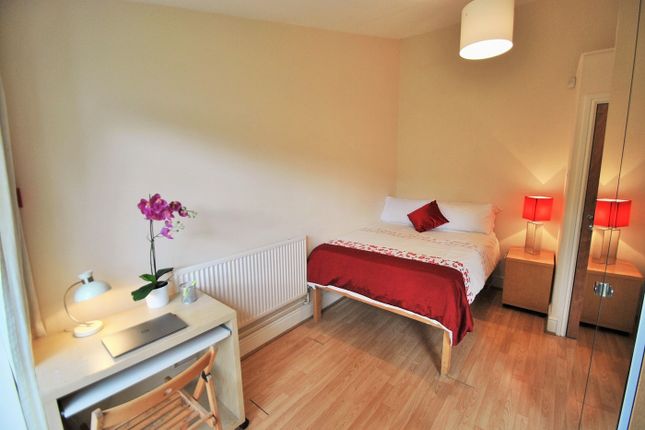 Bright And Inviting Double Bedroom Featuring A Com...