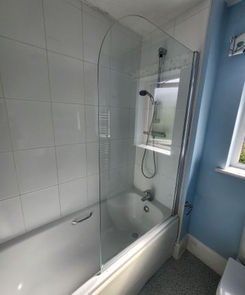 Bright And Clean Bathroom Suite Featuring A Modern...