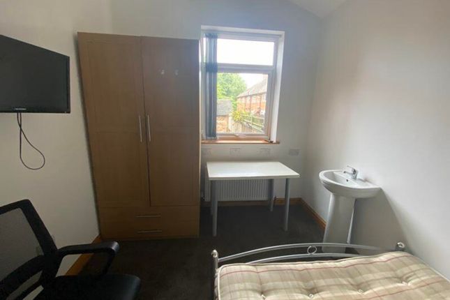 A Bright And Tidy Double Bedroom With A Desk And c...