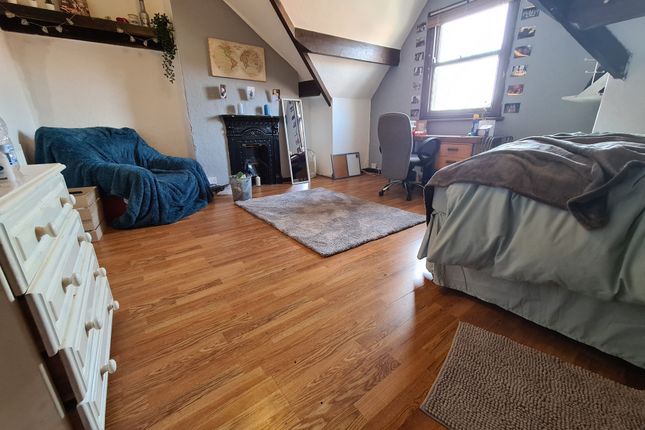 A Spacious And Inviting Master Bedroom Featuring A...