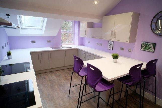 Bright And Modern Kitchen Featuring A Spacious Cen...