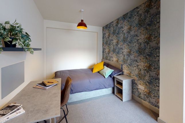 A Cozy Bedroom With A Comfortable Bed Featuring Co...