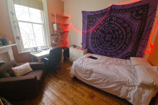 A Cozy Single Bedroom With A Comfortable Bed, A We...