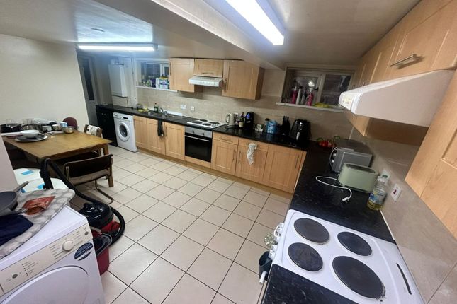 A Modern And Well-Equipped Kitchen Featuring Woode...