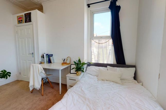 Bright And Airy Double Bedroom Featuring A Cozy Be...