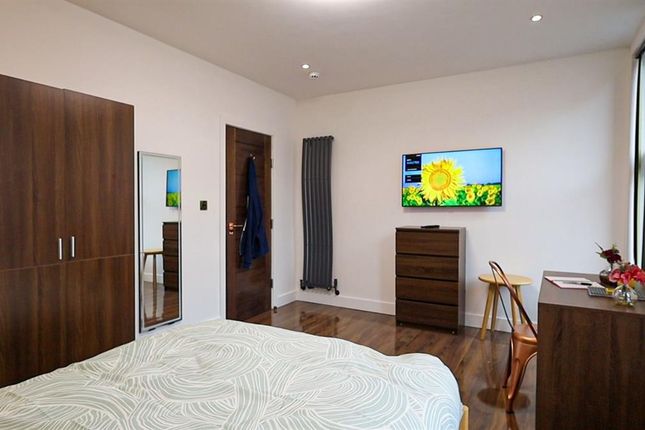 A Spacious And Well-Maintained Bedroom Featuring A...