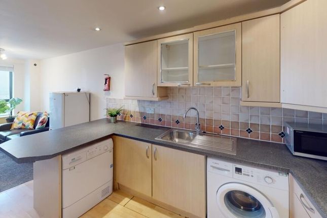 Bright And Modern Kitchen Area Featuring Ample Cou...
