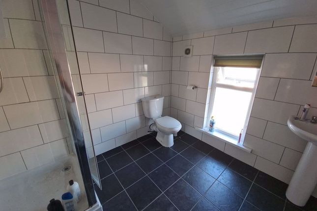 A Bright And Clean Bathroom Featuring A Modern Toi...