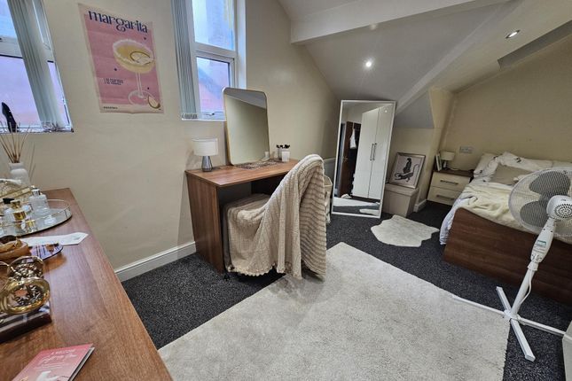 A Cozy, Well-Lit Bedroom Featuring A Double Bed An...