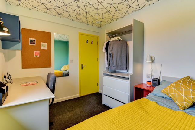 A Cozy And Modern Double Bedroom Featuring A Vibra...