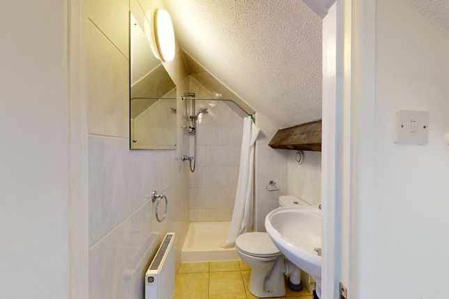 A Clean And Functional Bathroom With Ample Natural...