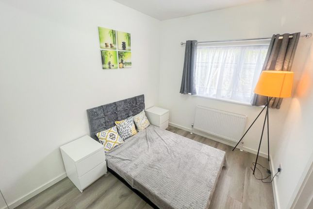 A Bright And Tidy Double Bedroom Featuring A Comfo...