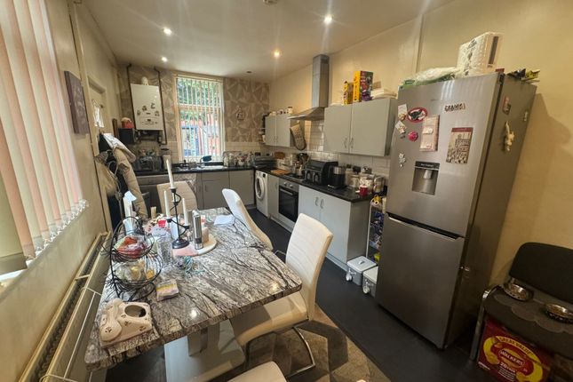 A Functional Kitchen Featuring A Dining Table With...