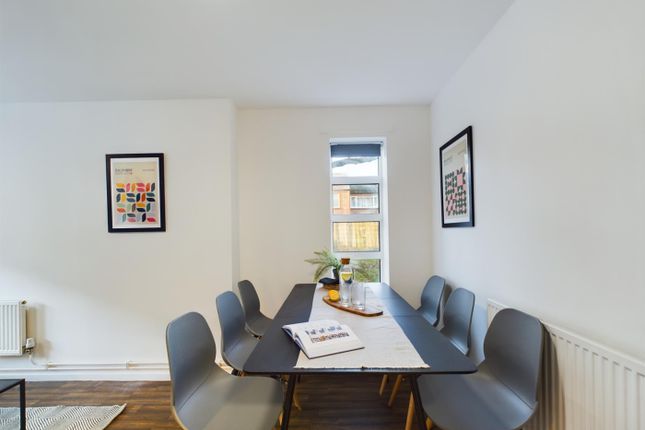 A Bright And Inviting Communal Workspace Featuring...