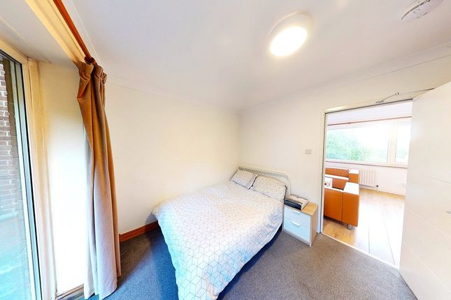 A Bright And Inviting Double Bedroom With Ample Na...