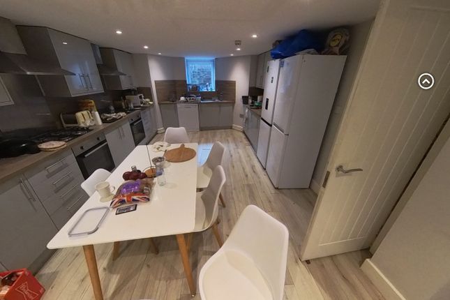 A Spacious, Well-Lit Living Room With Modern Furni...