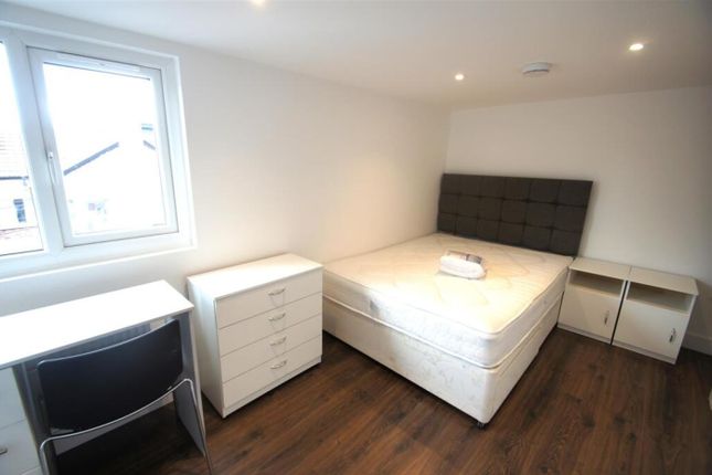 A Modern Double Bedroom Featuring A Comfortable Be...