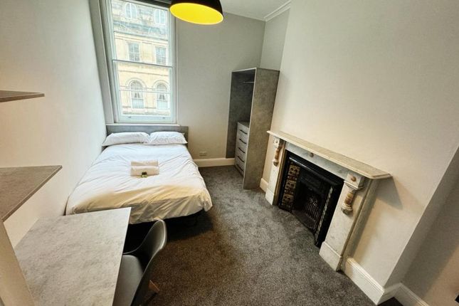 A Bright And Inviting Double Bedroom Featuring A c...