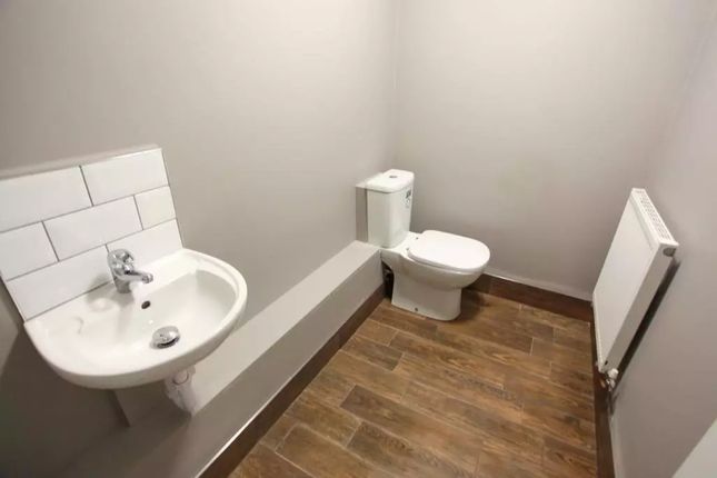 A Clean And Modern Single Toilet Room Featuring A ...