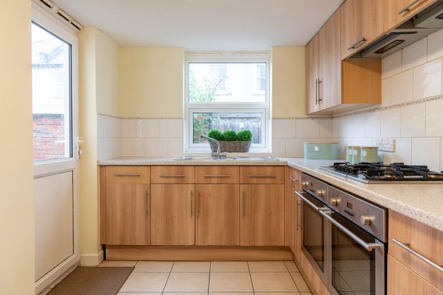 This Well-Designed Kitchen Features Ample Wooden c...