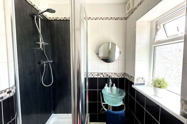 A Modern Bathroom Featuring A Stylish Shower And A...